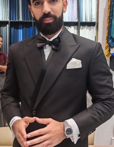 Bespoke tuxedo in Dubai – custom tailored black tuxedo with satin peak lapels.
